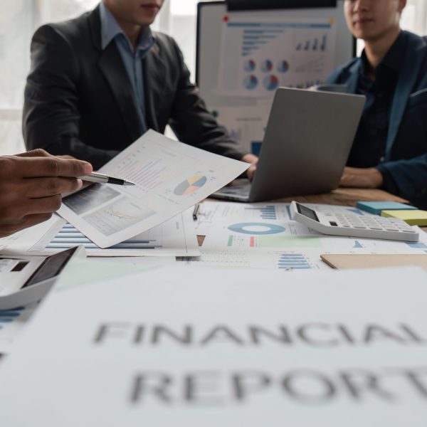 Business team working startup growth of the company and discussion analyzing for financial strategy statistics with computer, documents graph data results of collaboration their successful teamwork.